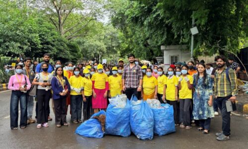Maid In India Leads Cleanliness Drive at Delhi Protest Site. Yellow T-Shirts, Blue Bags, One Mission.